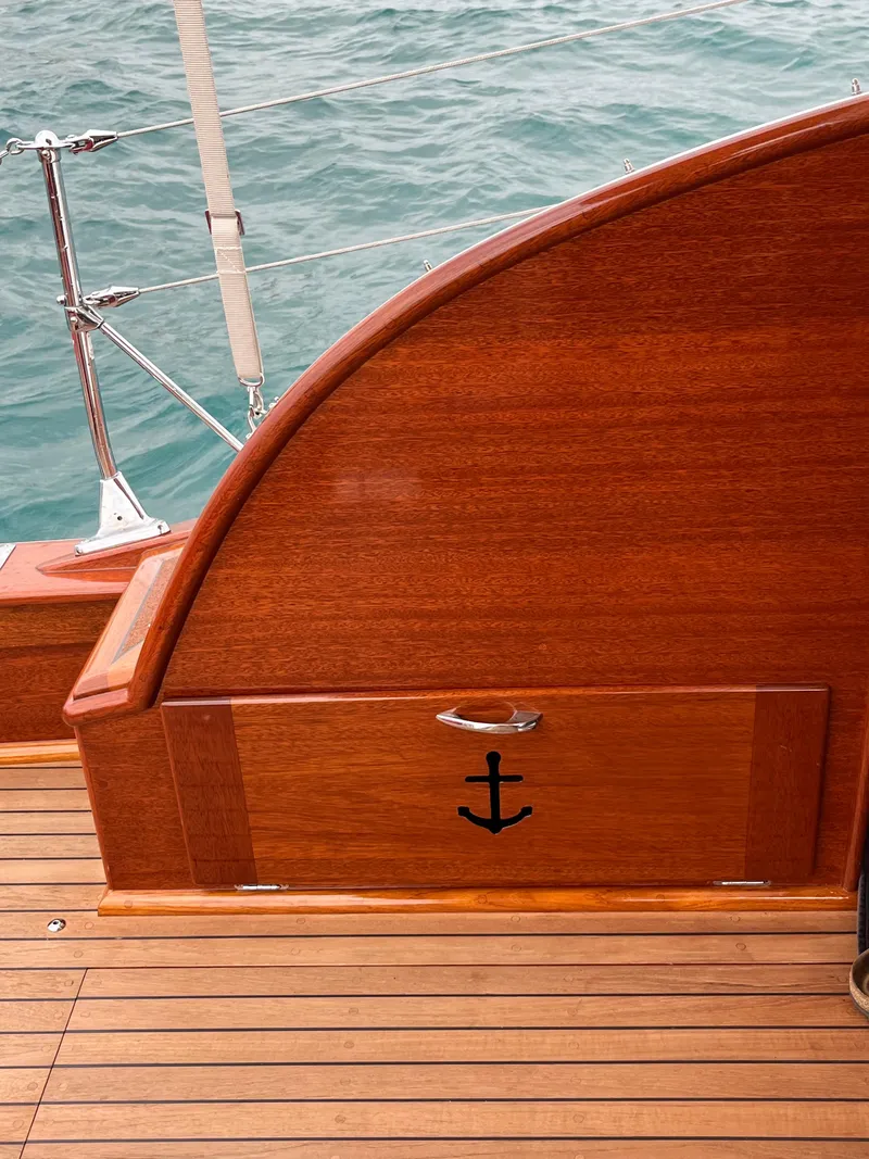 Slide: The Image of 1957 Chris-Craft 33 Futura wooden deck with anchor detail, overlooking the ocean. - 17