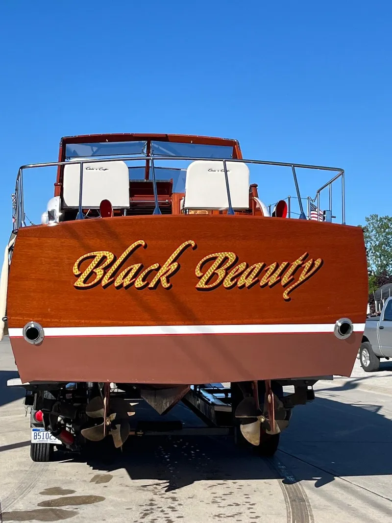 Slide: The Image of 1957 Chris-Craft 33 Futura boat named "Black Beauty" on trailer, rear view. - 18