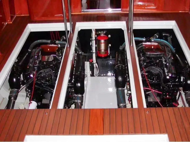 Slide: The Image of 1957 Chris-Craft 33 Futura engine compartment with dual engines and wooden deck. - 26
