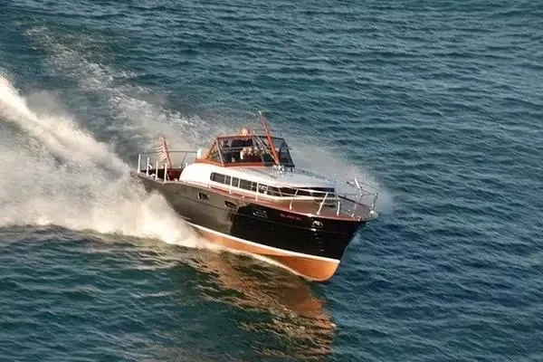 Slide: The Image of 1957 Chris-Craft 33 Futura cruising on open water, showcasing classic design and elegance. - 6