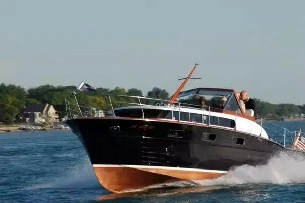 Slide: The Image of 1957 Chris-Craft 33 Futura cruising on a sunny day, showcasing classic design and elegance. - 9