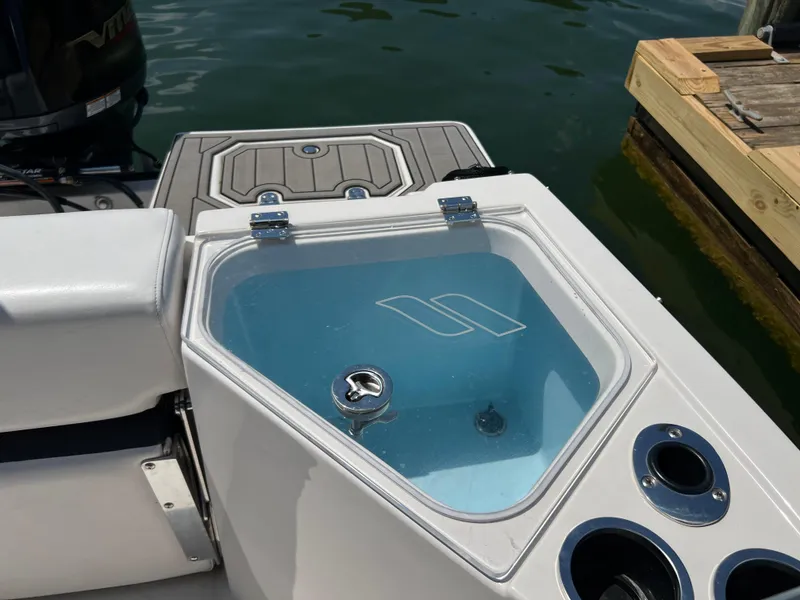 Slide: The Image of 2024 Starcraft SVX 211 OB CC boat with livewell and rod holders. - 8