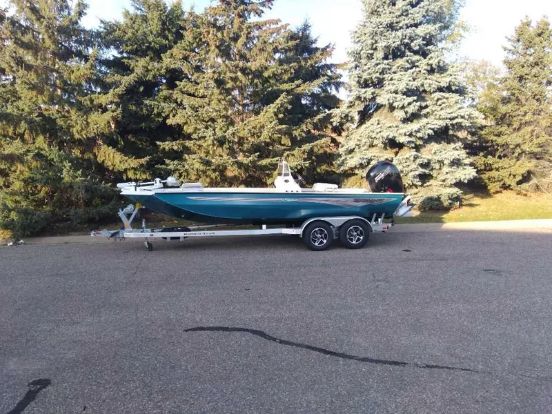 Slide: The Image of 2024 Ranger RB200 boat on trailer, parked near trees. - 4