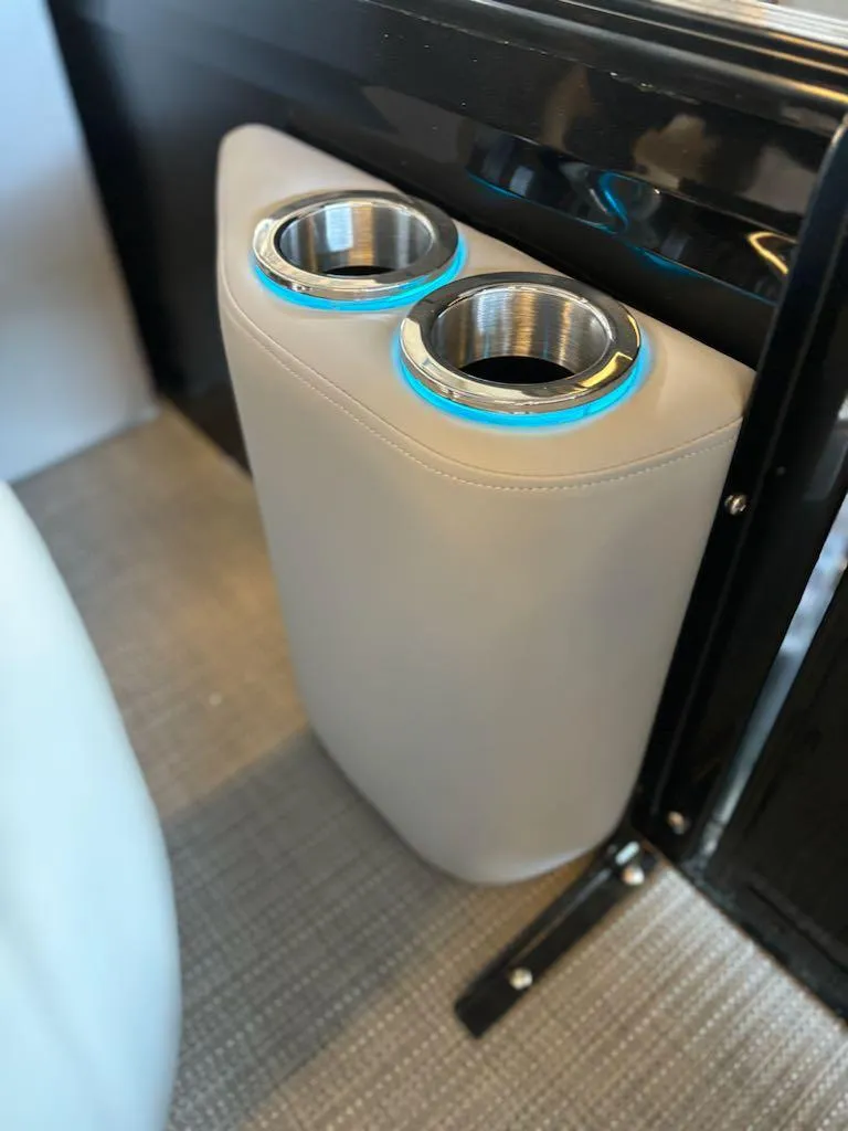 Slide: The Image of 2024 Regency 250 LE3 boat cup holders with blue LED lighting. - 12