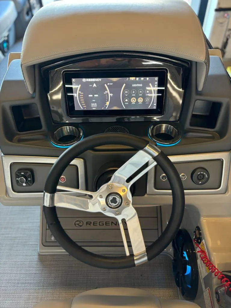 Slide: The Image of 2024 Regency 250 LE3 dashboard with modern steering wheel and digital display. - 13