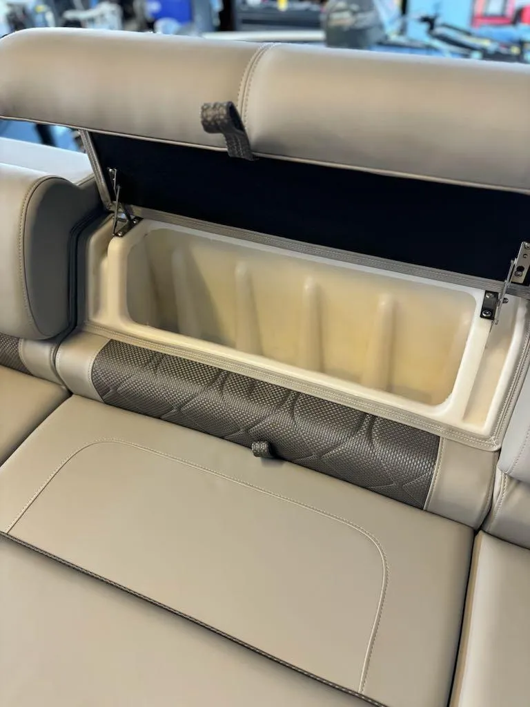 Slide: The Image of 2024 Regency 250 LE3 boat seat with built-in storage compartment. - 6