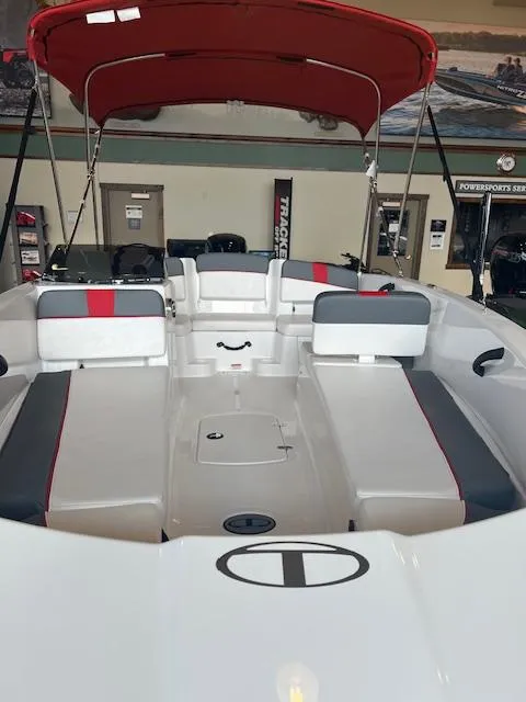 Slide: The Image of 2024 Tahoe T18 boat interior with red canopy and seating. - 4