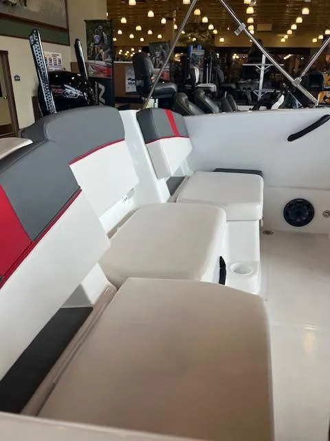 Slide: The Image of 2024 Tahoe T18 boat interior with white and gray seating, red accents, and modern design. - 5
