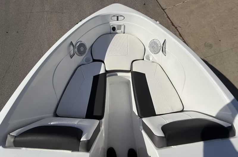 Slide: The Image of 2024 Tahoe 200 S boat interior with cushioned seating and speakers. - 6