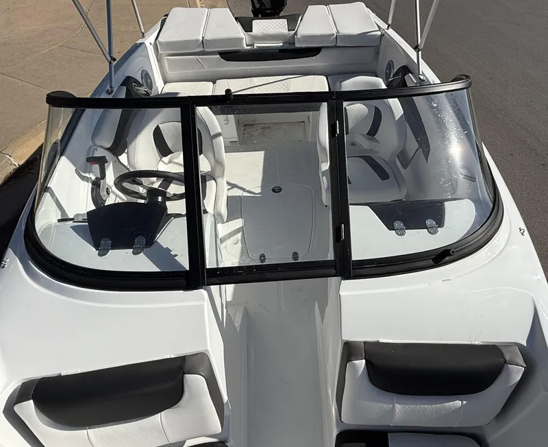 Slide: The Image of 2024 Tahoe 200 S boat interior with white seating and black accents. - 8