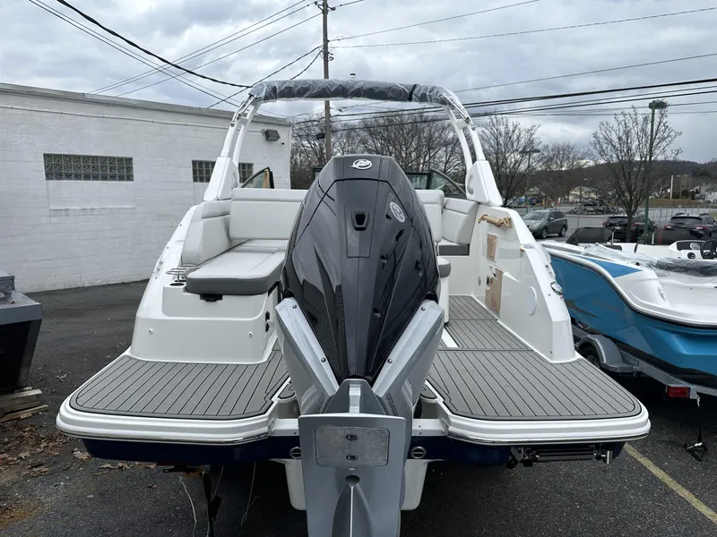 Slide: The Image of 2024 Sea Ray SDX 250 Outboard boat, rear view, parked outdoors. - 2