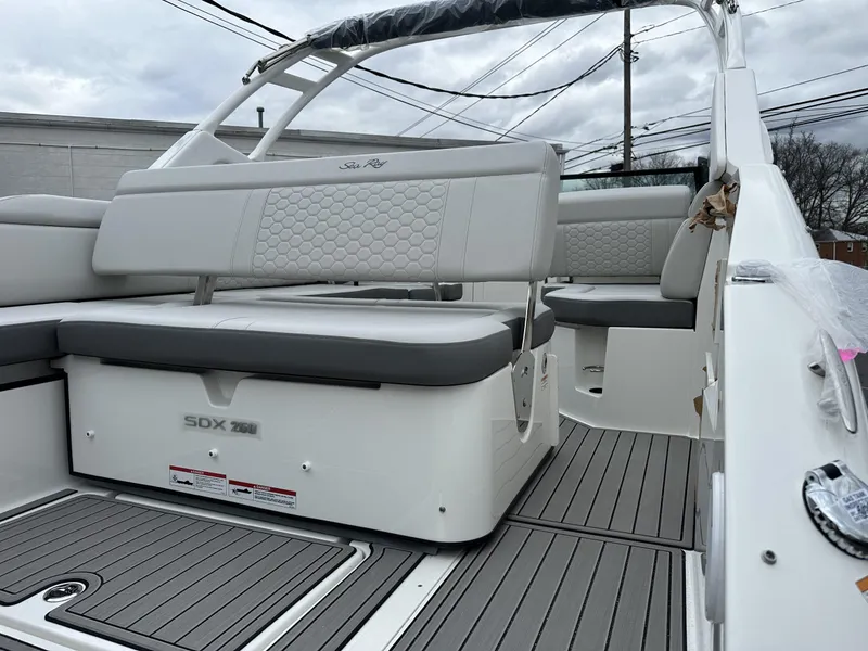 Slide: The Image of 2024 Sea Ray SDX 250 Outboard boat interior with gray seating and deck. - 5
