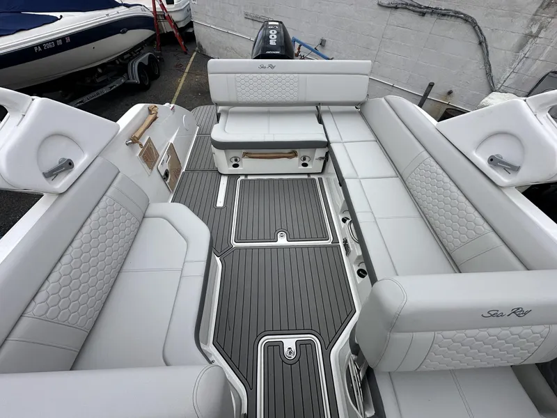 Slide: The Image of 2024 Sea Ray SDX 250 Outboard interior with luxurious seating and modern design. - 7