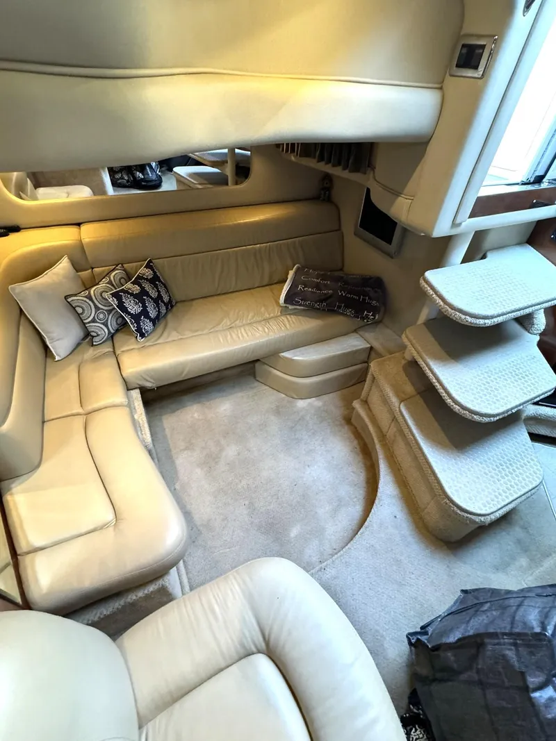 Slide: The Image of Luxurious interior of 2003 Sea Ray 38 Sundancer yacht with beige leather seating. - 15
