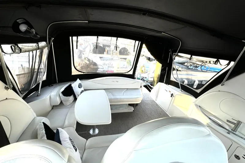 Slide: The Image of Interior of 2003 Sea Ray 38 Sundancer yacht with elegant seating and table. - 4