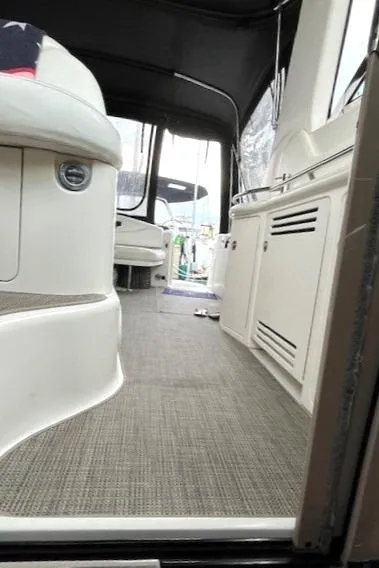 Slide: The Image of Interior view of 2003 Sea Ray 38 Sundancer yacht with carpeted flooring. - 8