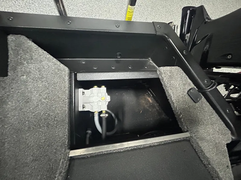 Slide: The Image of 2025 Alumacraft Competitor 175X CS boat interior storage compartment. - 11