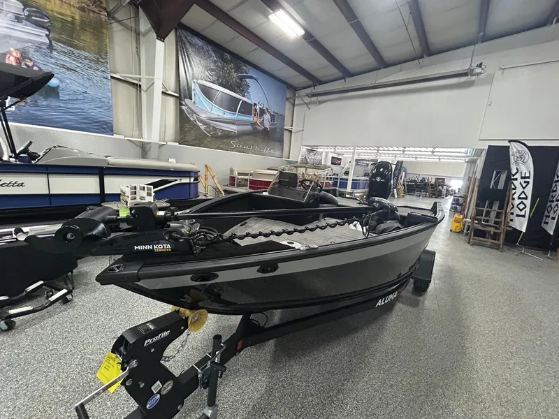 Slide: The Image of 2025 Alumacraft Competitor 175X CS boat with Suzuki engine in showroom. - 3
