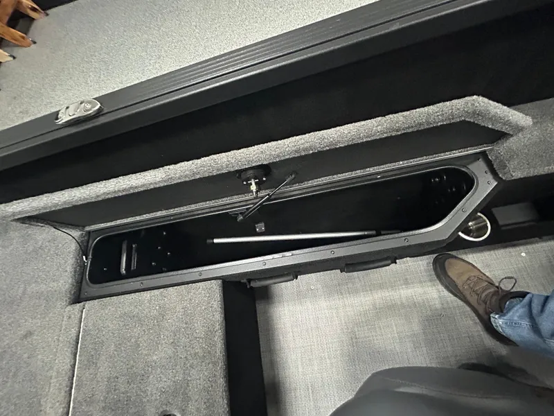 Slide: The Image of 2025 Alumacraft Competitor 175X CS boat interior with open storage compartments. - 8