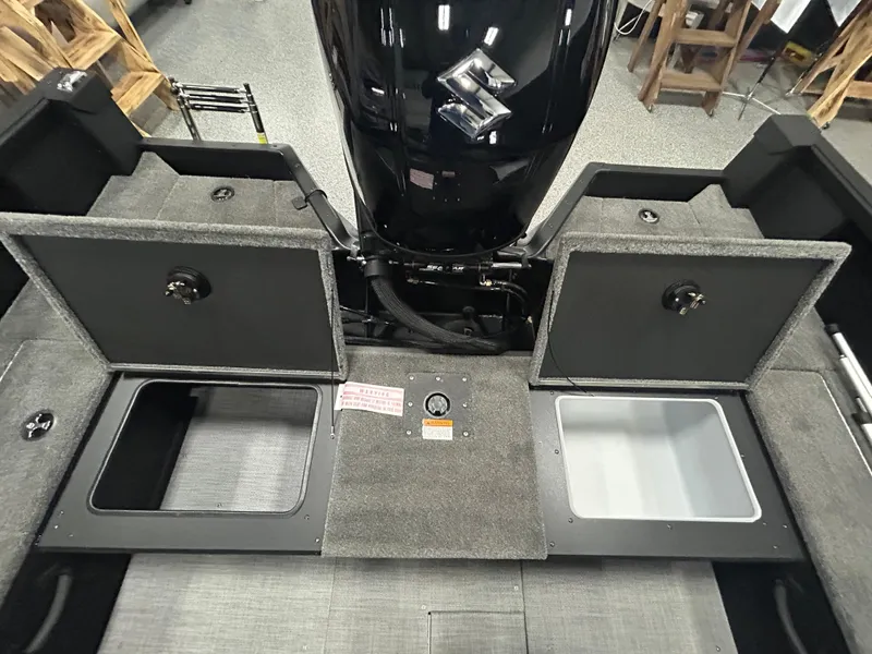 Slide: The Image of 2025 Alumacraft Competitor 175X CS boat storage compartments with organized interior layout. - 9