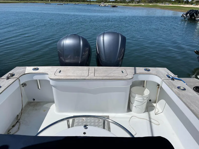 Slide: The Image of 2006 Croswait 28CC boat with dual engines on calm water. - 3