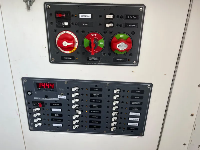 Slide: The Image of Control panel of a 2006 Croswait 28CC boat with switches and indicators. - 7