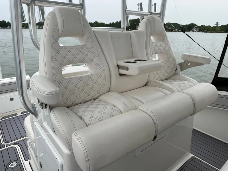 Slide: The Image of The 2020 Tideline 365 Offshore features luxurious, cushioned seats with diamond patterns and armrests. - 7
