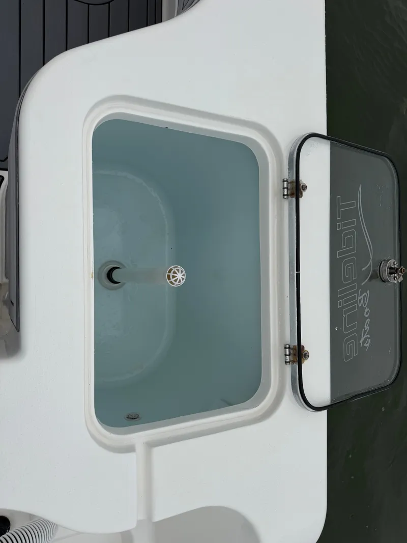 Slide: The Image of An open rectangular compartment on a boat filled with water. - 18