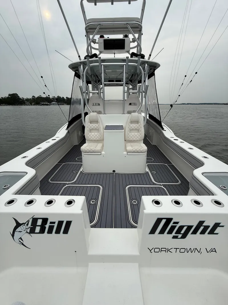 Slide: The Image of The image shows a 2020 Tideline 365 Offshore boat with a spacious deck and comfortable seating. - 11
