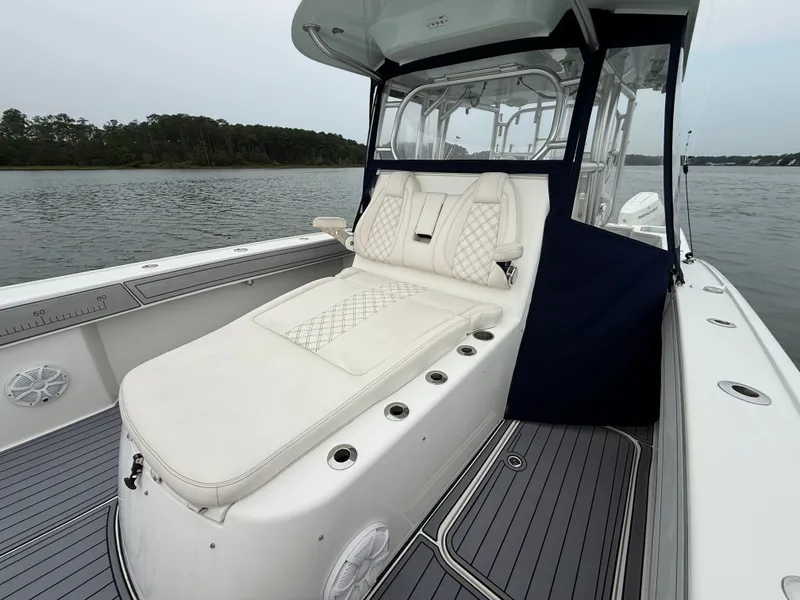 Slide: The Image of The 2020 Tideline 365 Offshore features a sleek white deck with cushioned seating. - 22