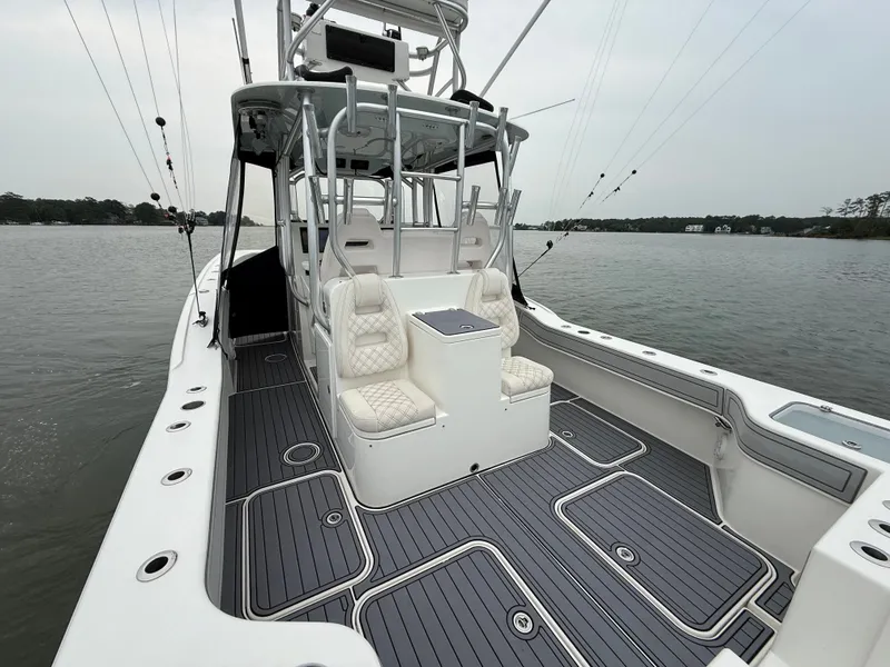 Slide: The Image of The image shows a 2020 Tideline 365 Offshore boat with sleek seating and modern design. - 12