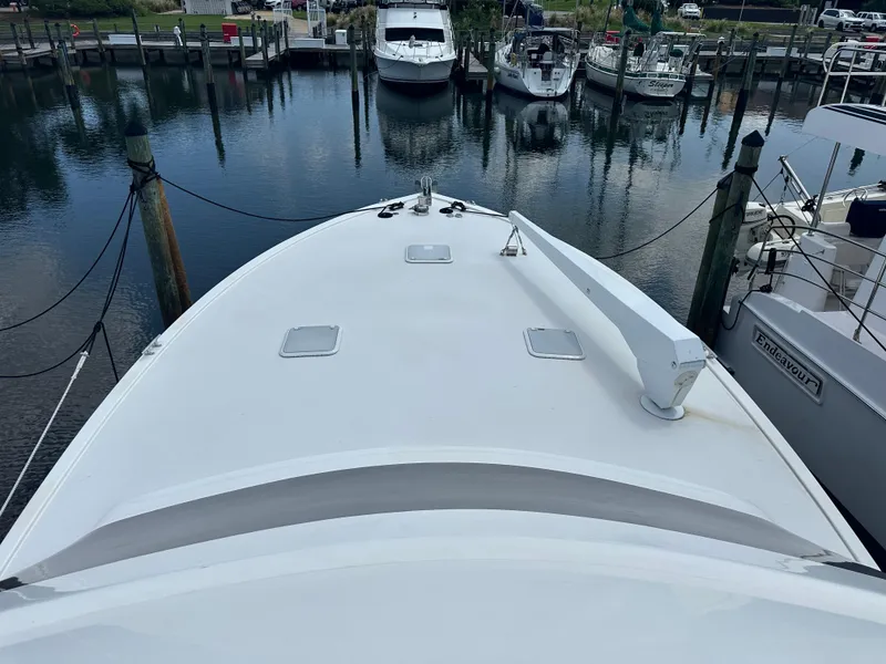 Slide: The Image of 2005 Post 53 Convertible yacht docked at marina, aerial view. - 23