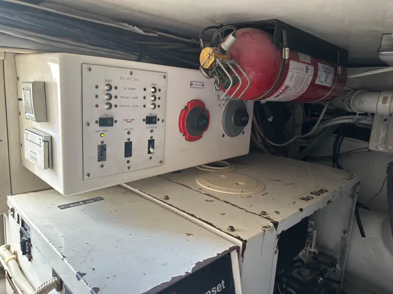 Slide: The Image of Engine room of 2005 Post 53 Convertible with control panel and fire extinguisher. - 26
