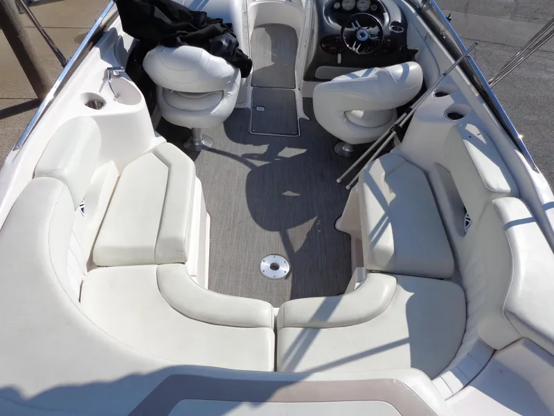Slide: The Image of 2007 Regal 2400 Bowrider interior with white seating and steering wheel. - 6