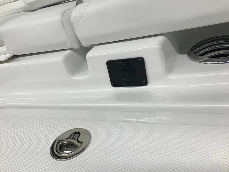 Slide: The Image of 2025 Four Winns H4 boat interior detail with white seating and metal fixtures. - 10