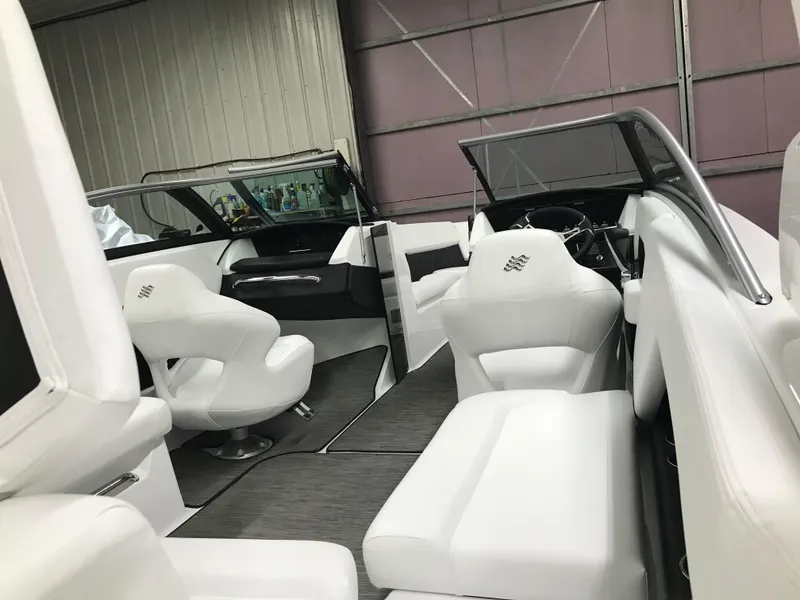 Slide: The Image of 2025 Four Winns H4 boat interior with white seating and modern design. - 14