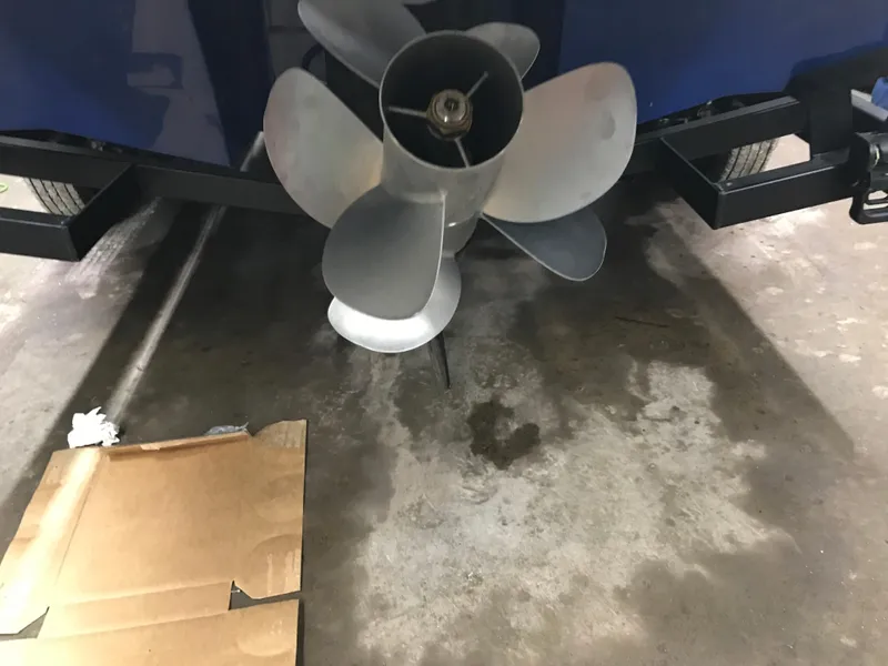 Slide: The Image of Propeller of 2025 Four Winns H4 boat on a trailer in a garage. - 17