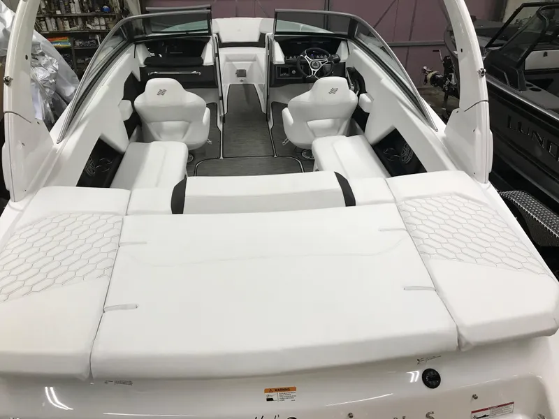 Slide: The Image of 2025 Four Winns H4 boat interior with white seating and modern design. - 18