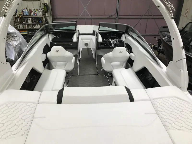 Slide: The Image of 2025 Four Winns H4 boat interior with white seating and modern design. - 19