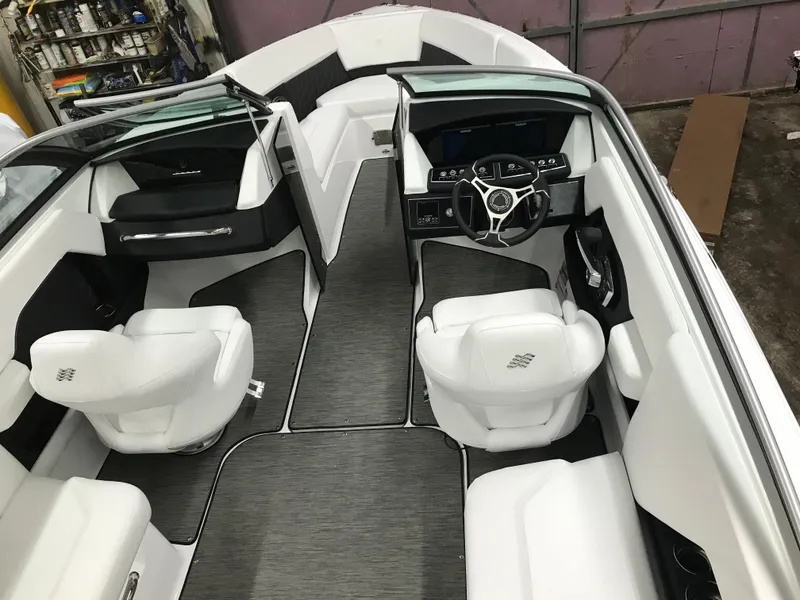 Slide: The Image of 2025 Four Winns H4 boat interior with modern seating and sleek dashboard design. - 21
