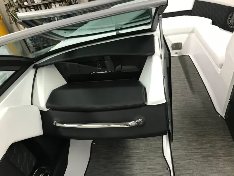 Slide: The Image of 2025 Four Winns H4 boat interior with sleek black and white seating and modern design. - 25