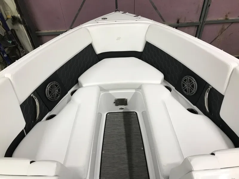 Slide: The Image of 2025 Four Winns H4 boat interior with white seating and built-in speakers. - 27