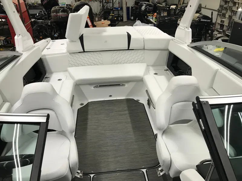 Slide: The Image of 2025 Four Winns H4 boat interior with white seating and modern design. - 28