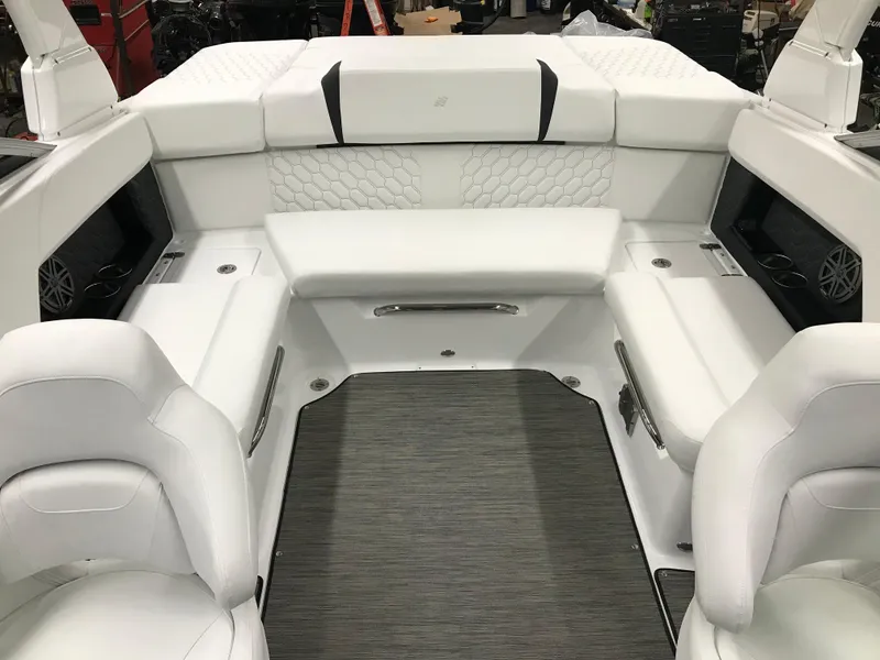 Slide: The Image of 2025 Four Winns H4 boat interior with luxurious white seating and modern design. - 29