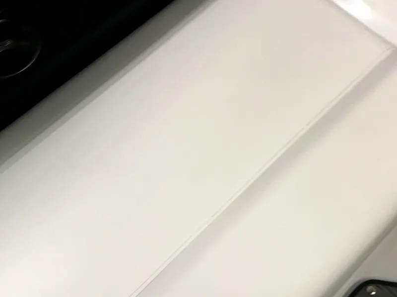 Slide: The Image of 2025 Four Winns H4 boat interior detail, featuring sleek white surface design. - 31