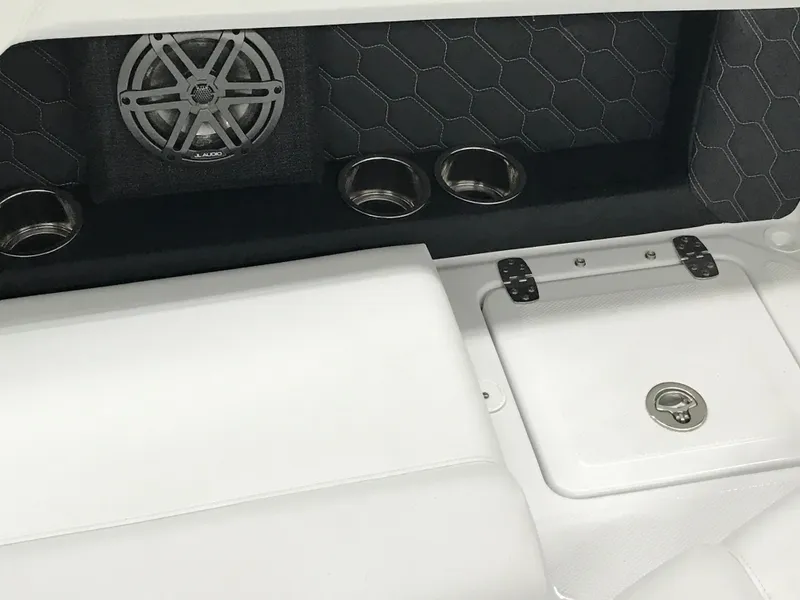 Slide: The Image of 2025 Four Winns H4 boat interior with speaker and cup holders. - 35