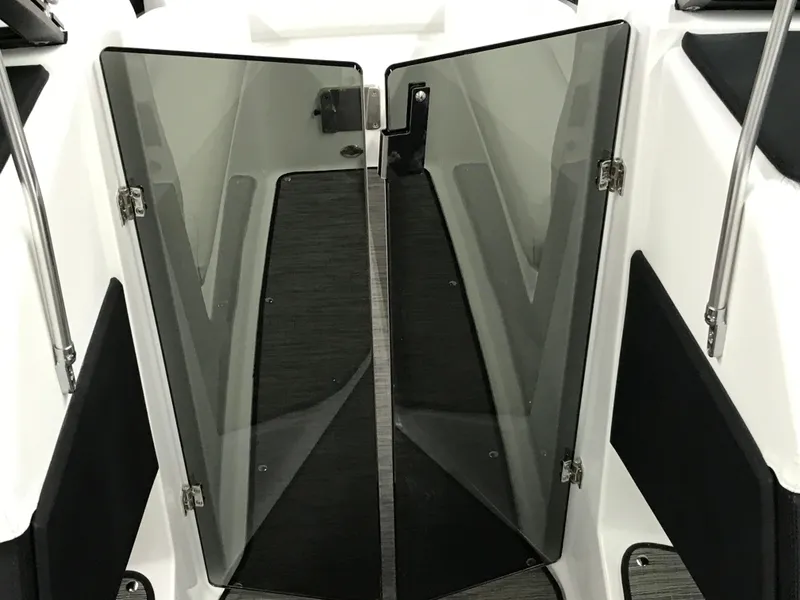 Slide: The Image of 2025 Four Winns H4 boat with open glass doors, showcasing sleek interior design. - 41