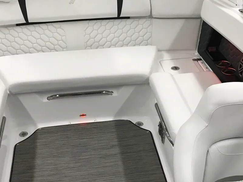 Slide: The Image of 2025 Four Winns H4 boat interior with white seating and modern design. - 46