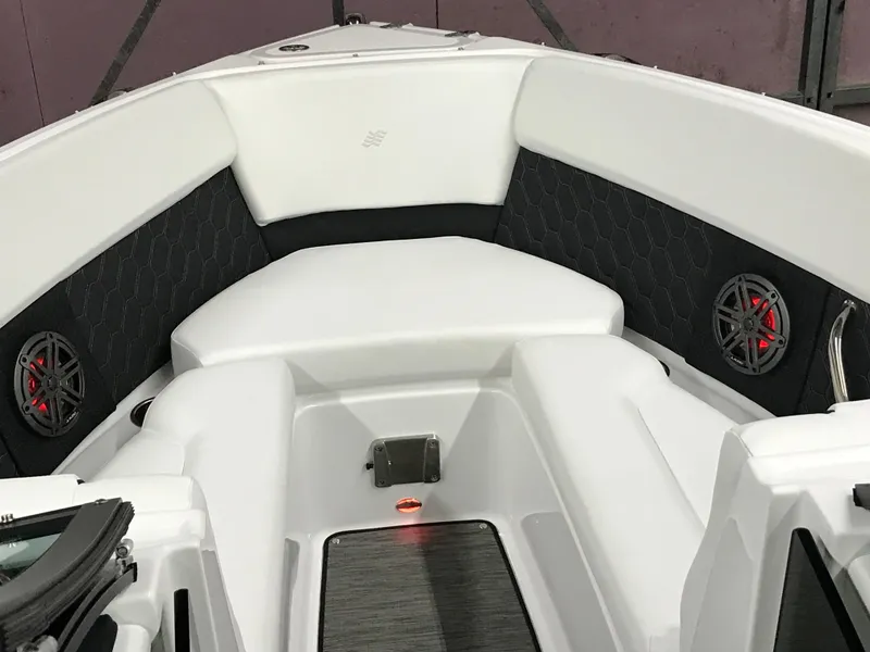 Slide: The Image of 2025 Four Winns H4 boat interior with white seating and black accents. - 48