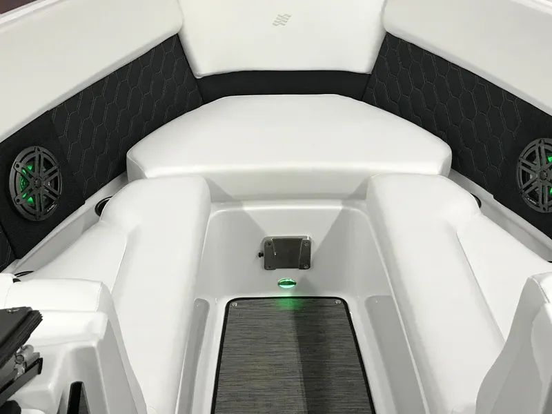 Slide: The Image of Interior of 2025 Four Winns H4 boat with white seating and green LED lights. - 49